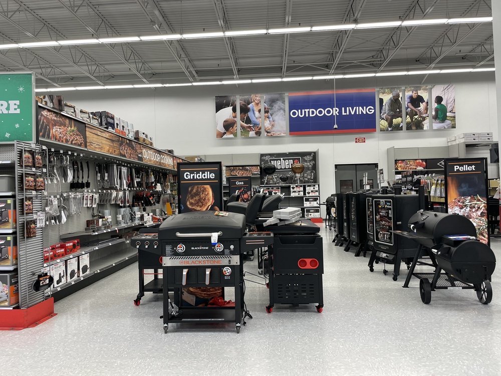 Academy Sports + Outdoors grilling department with grills, griddles and cooking accessories
