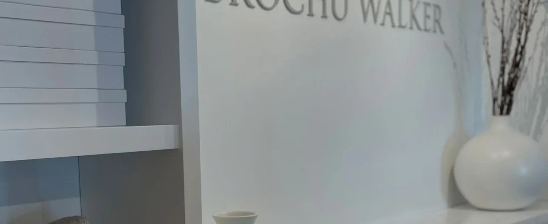 Brochu Walker store signage Brochu Walker wall signage above cabinets and decorative vases