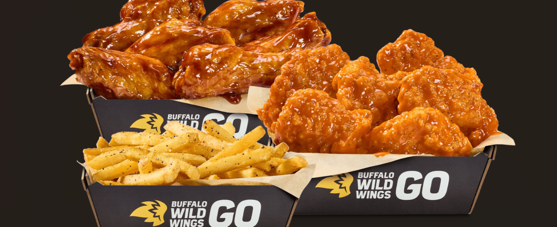 Traditional wings, boneless wings, and fries in Buffalo Wild Wings GO boxes