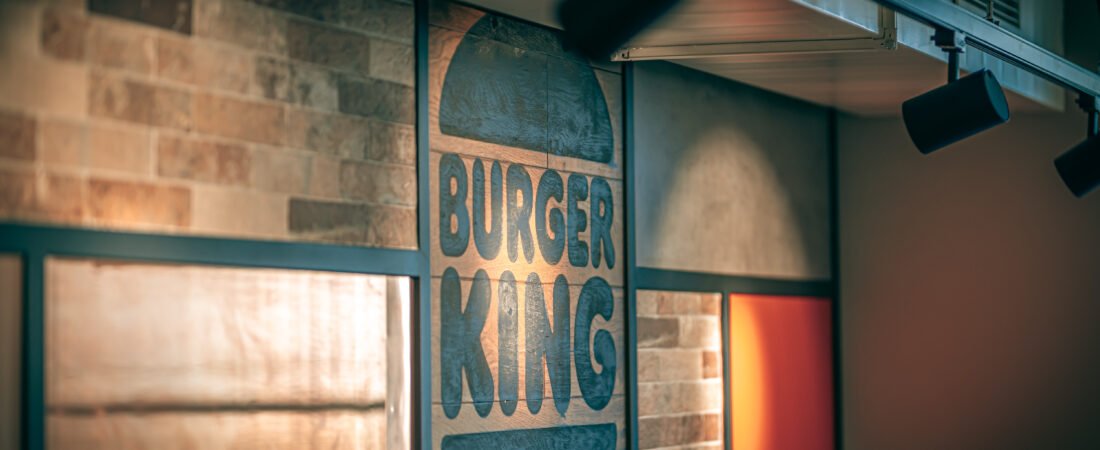 Burger King restaurant interior featuring branded wall signage