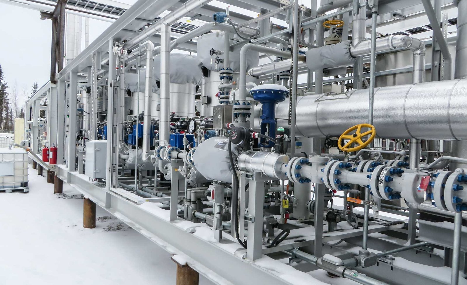 Representative CoreWorks equipment with industrial piping, valves and insulated components