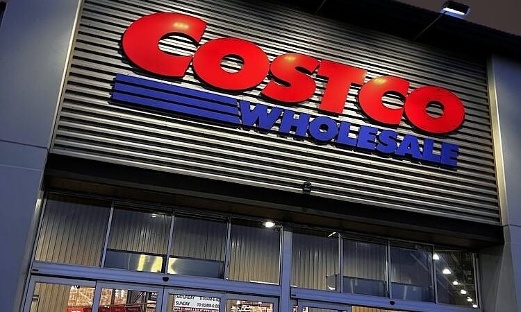 Costco Wholesale Entrance Costco Wholesale sign above the illuminated entrance of an existing warehouse