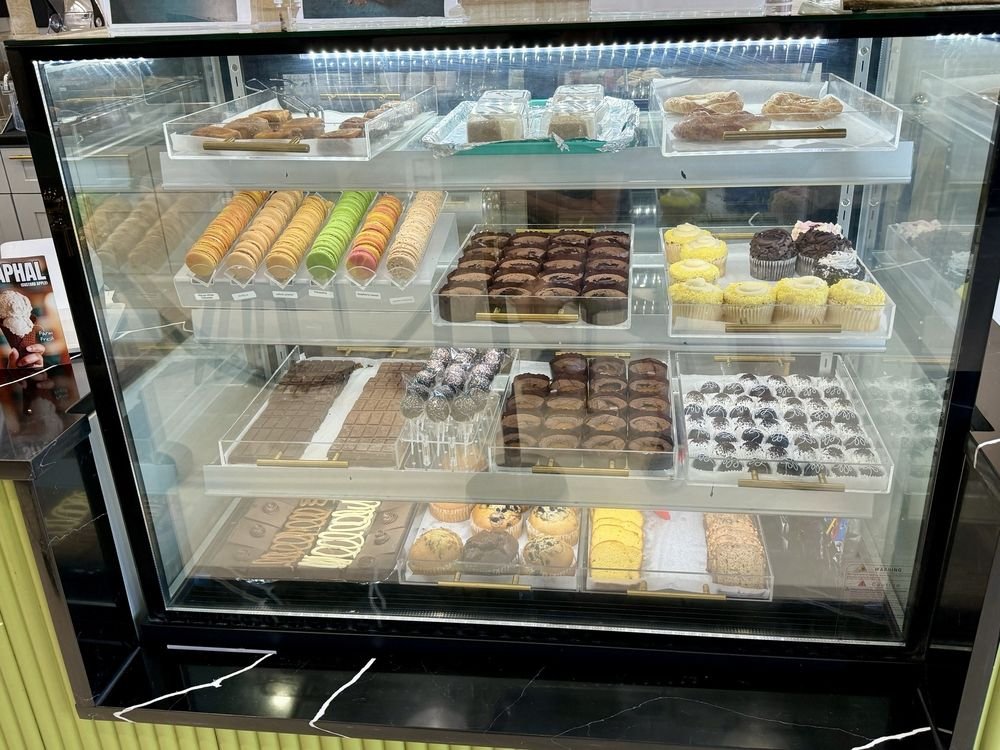 Dumont Creamery and Cafe display case filled with macarons, cupcakes and pastries