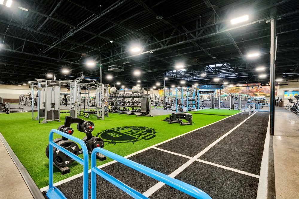 Representative EōS workout floor with turf and strength equipment for the EOS Fitness Forney story