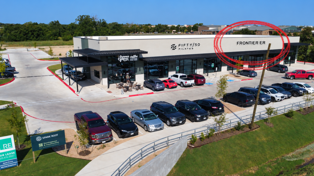 Marketing image identifying the planned Frontier ER space beside Fifty/50 Pilates and Summer Moon in Leander.