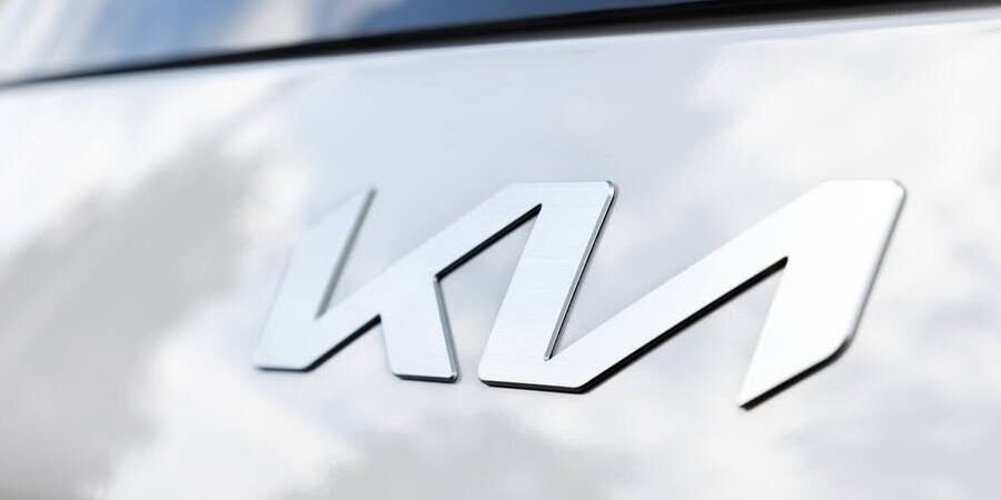 Kia emblem on the hood of a white EV9