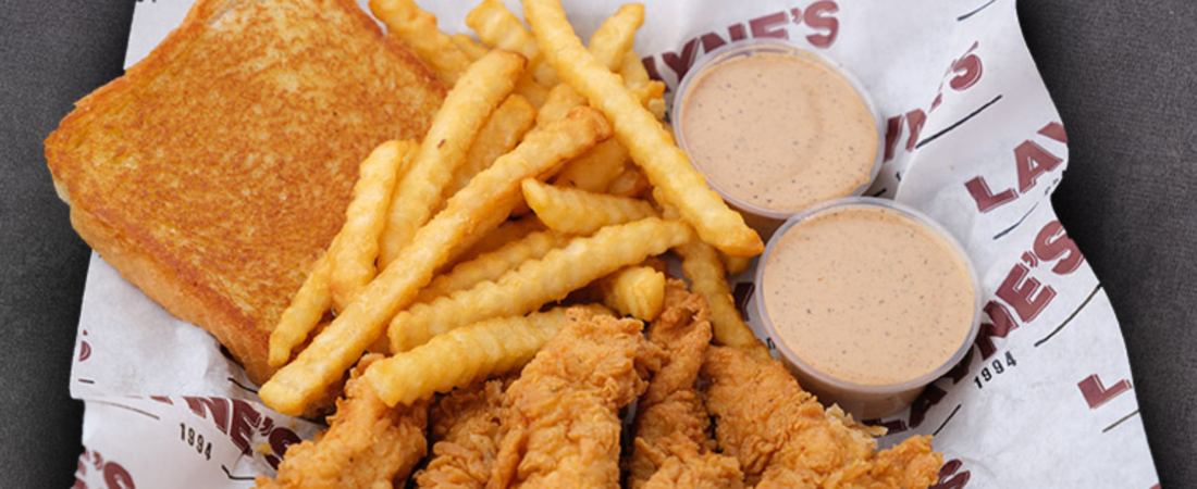 Layne's chicken fingers with crinkle-cut fries, Texas toast, and dipping sauce