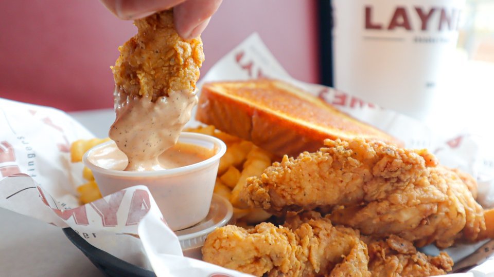 Layne's Chicken in Buda will offer finger dipped in sauce beside crispy tenders and Texas toast