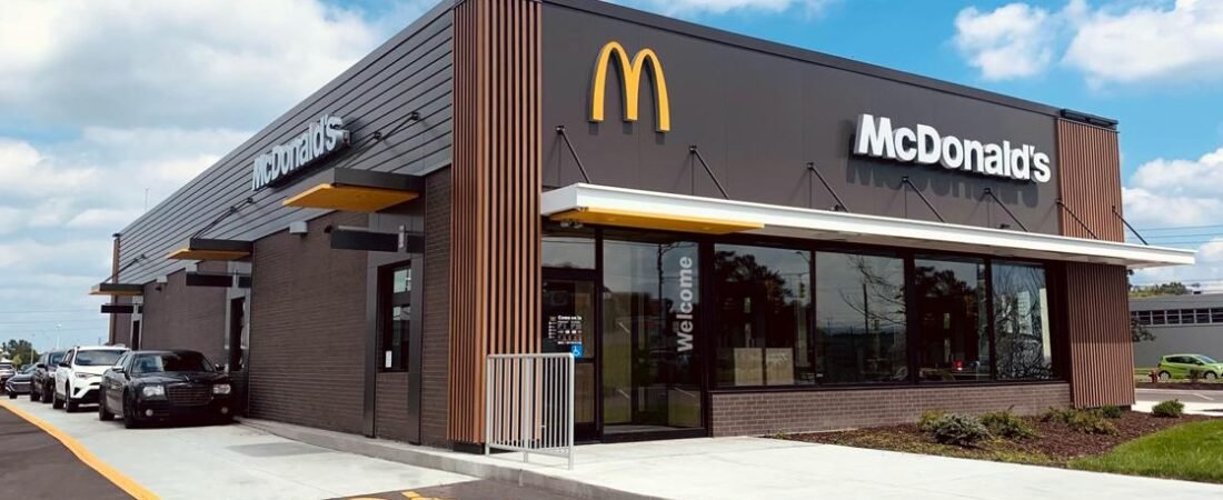 Editorial illustration of a modern McDonald's restaurant.