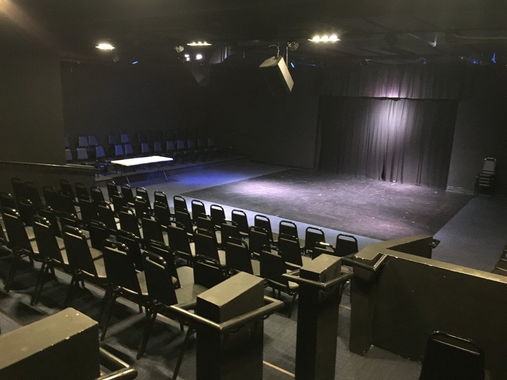 NTPAStage Existing North Texas Performing Arts theater with seating around a black-box stage