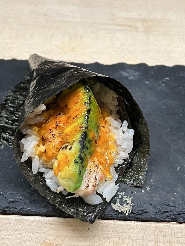Nori Handroll Bar Temaki Nori Handroll Bar hand roll with rice, avocado, and filling wrapped in seaweed.
