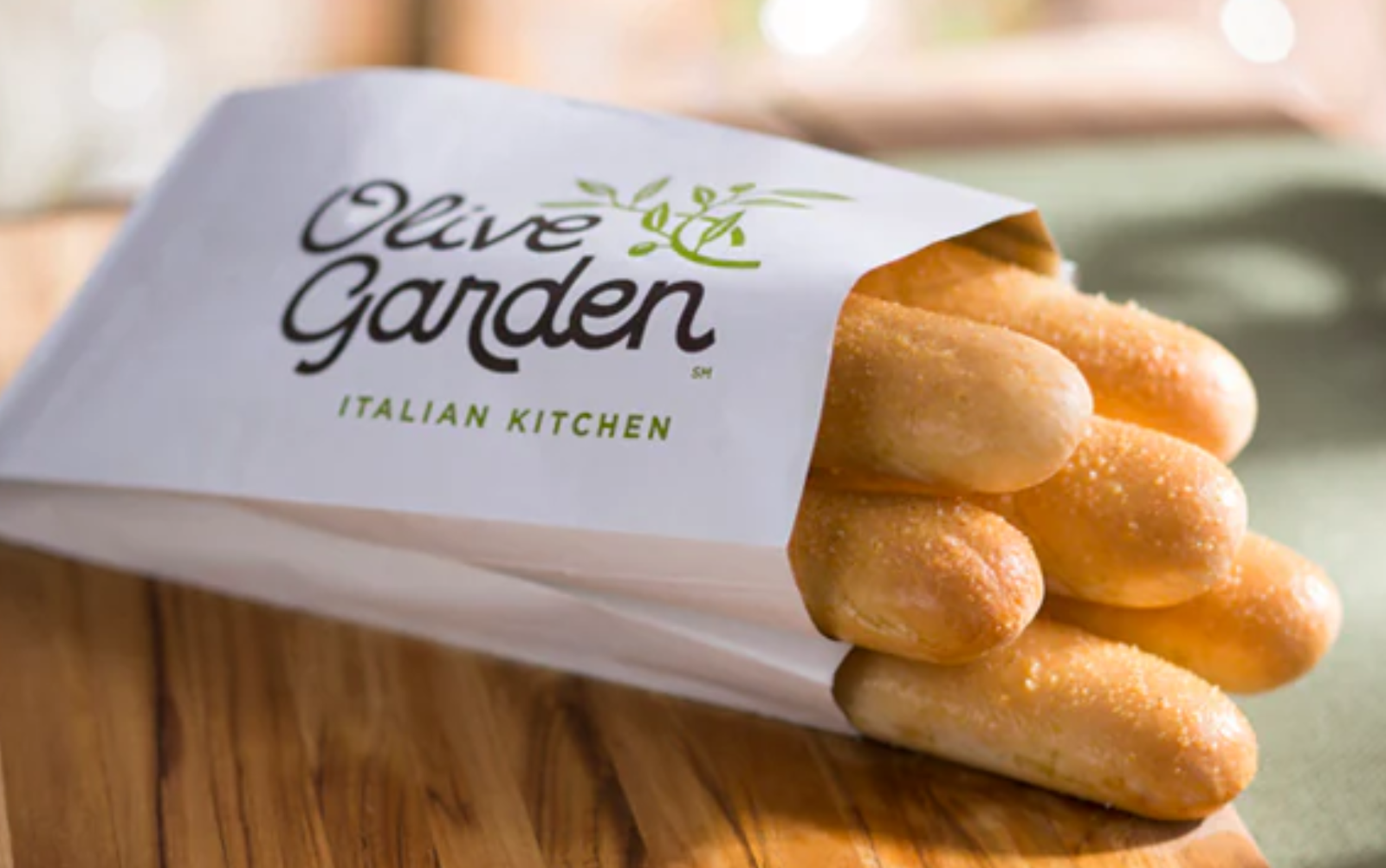 Olive Garden Breadsticks Olive Garden breadsticks in a branded paper sleeve