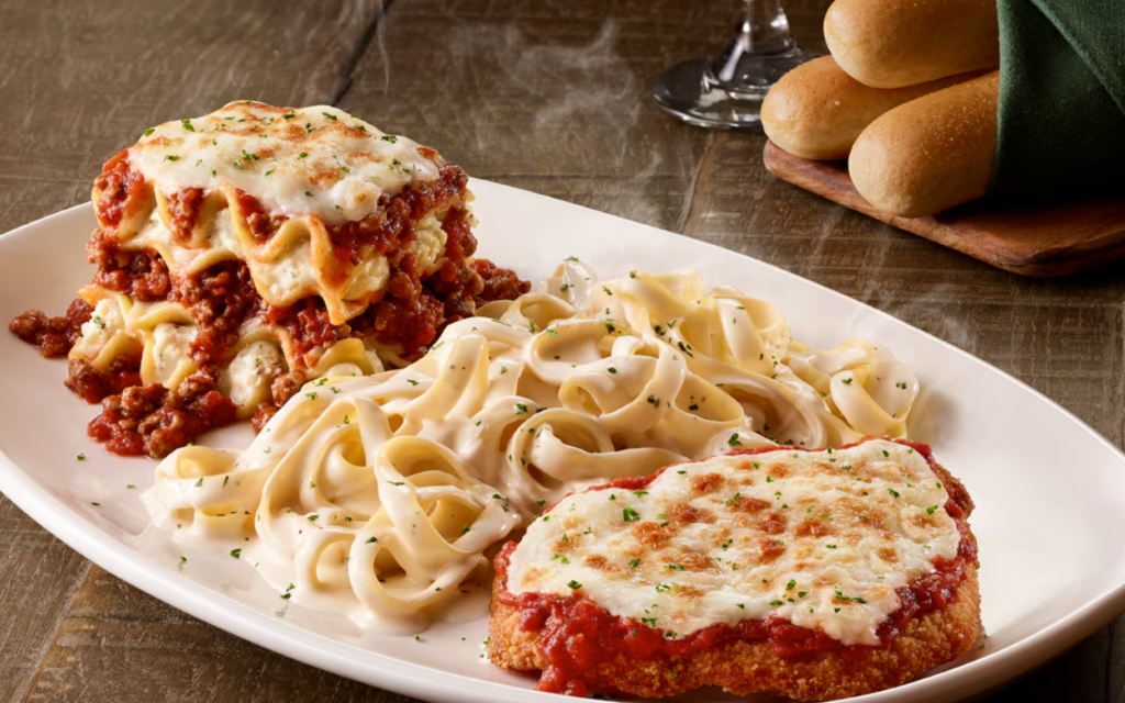 Olive Garden plate with lasagna, fettuccine Alfredo, chicken and breadsticks