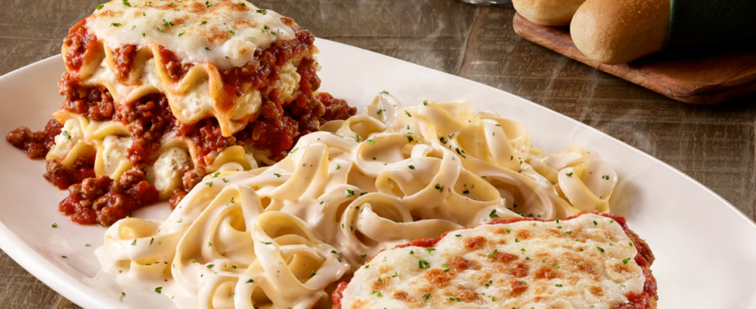 Olive Garden Pasta and Chicken Entrée Olive Garden plate with lasagna, fettuccine Alfredo, chicken and breadsticks