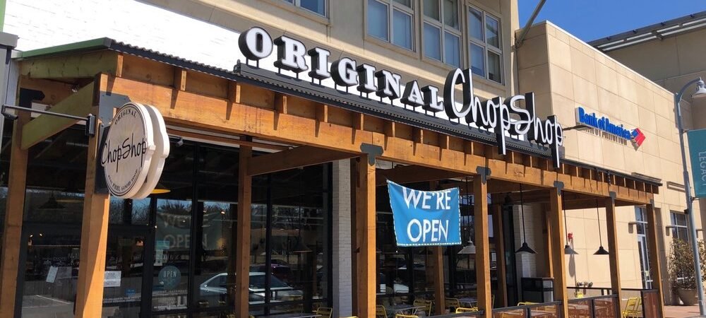 Original ChopShop — Representative Exterior Representative Original ChopShop exterior with storefront signage and patio seating
