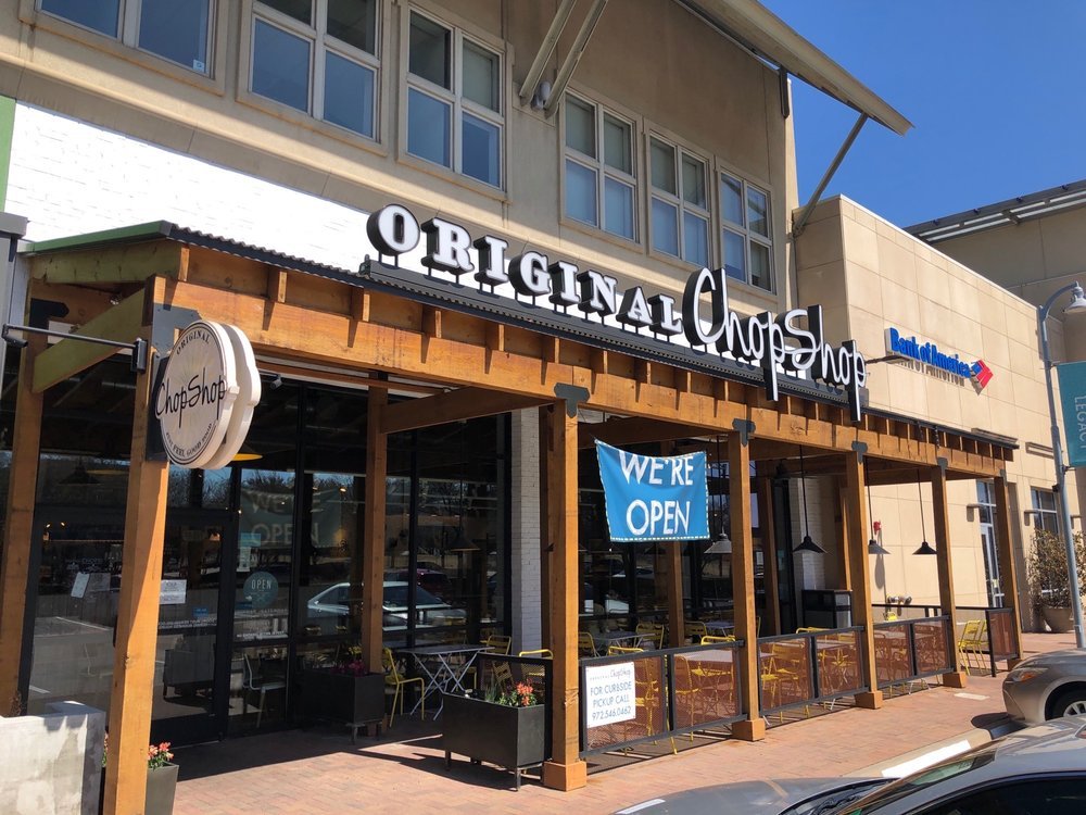 Representative Original ChopShop exterior with storefront signage and patio seating