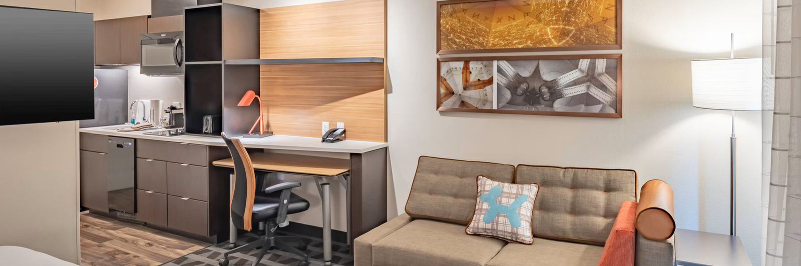 TownePlace Suites by Marriott Guest Suite Panoramic view of a TownePlace Suites by Marriott guest suite with living, sleeping and kitchen areas