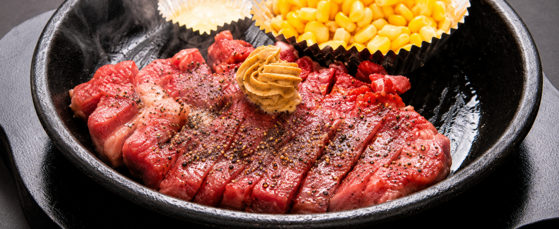 Pepper Lunch sizzling steak with corn and butter on an iron plate