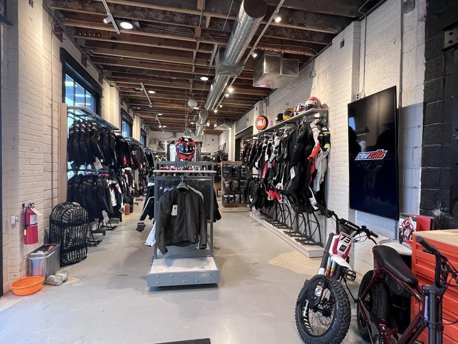 Riding jackets and motorcycle gear displayed inside an existing RevZilla showroom Riding jackets and motorcycle gear displayed inside an existing RevZilla showroom