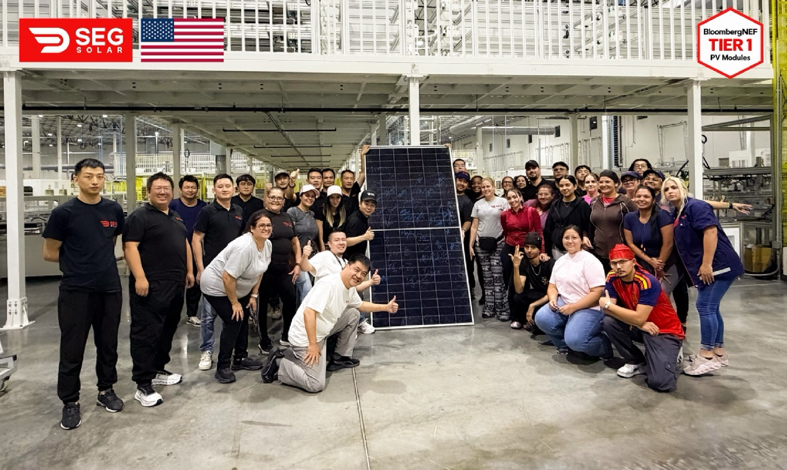 SEG SOLAR SIGNING SEG Solar workers pose with an HJT solar module on the Tomball #1 factory floor
