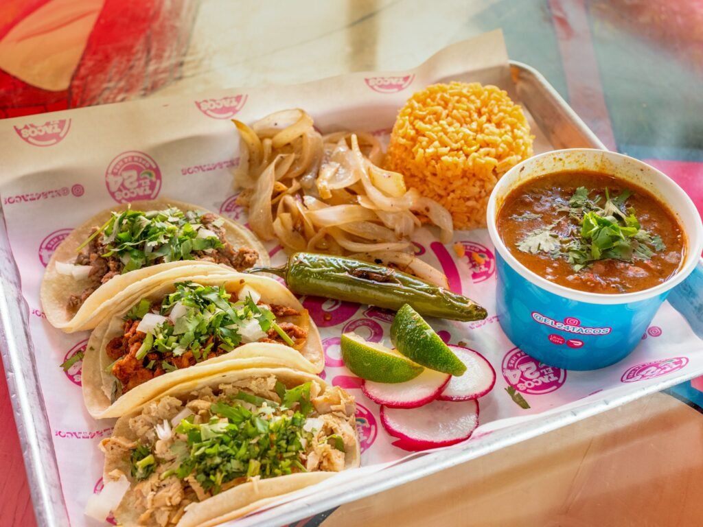 Taco El 24 Menu selections featuring tacos, rice, menudo
