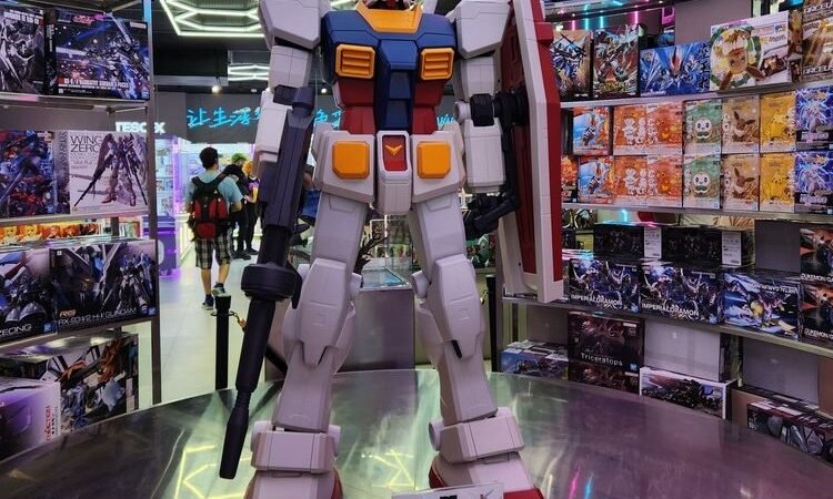 TESO-X collectible display Large robot figure surrounded by shelves of collectible model kits at an existing TESO-X store