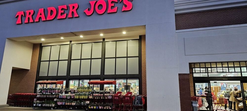 Trader Joe’s storefront with red lettering, shopping carts, and entrance