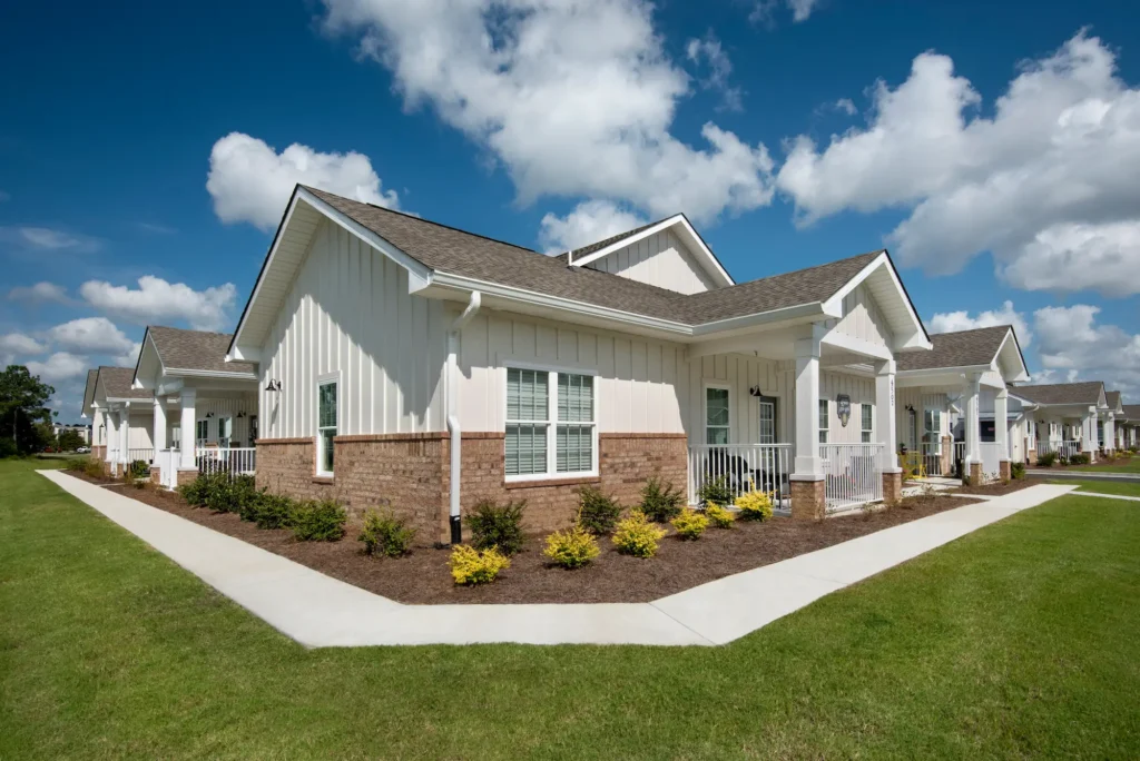 Wayfare single-story apartment homes with covered porches and landscaped walkways