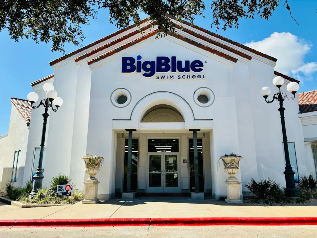 Representative Big Blue Swim School exterior with entrance and blue signage