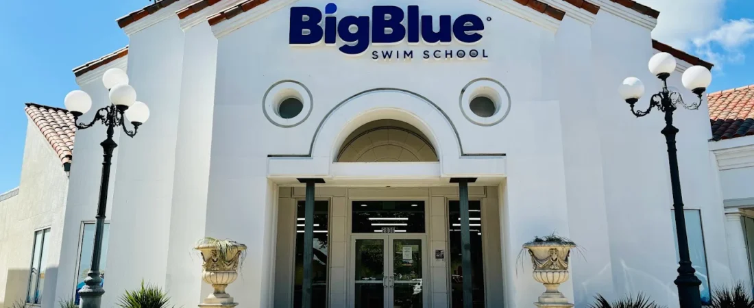 Big Blue Swim School — Representative Exterior Representative Big Blue Swim School exterior with entrance and blue signage