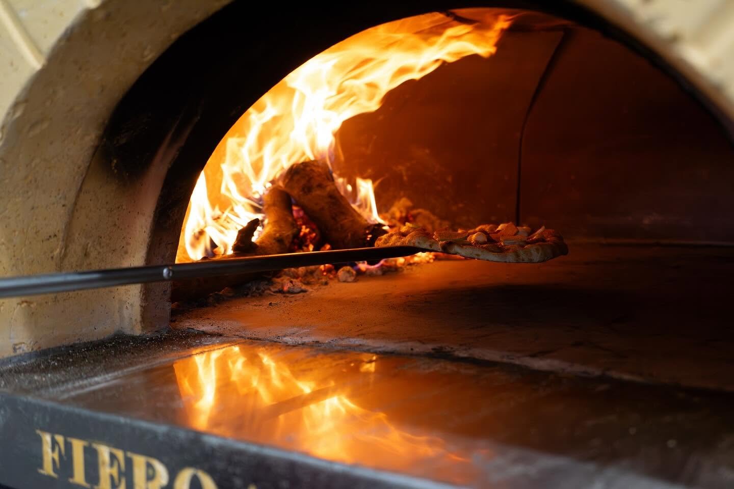 Wood-Fired Pizza Oven Pizza beside oven flames — representative image for the Cascadia Pizza Co Frisco story
