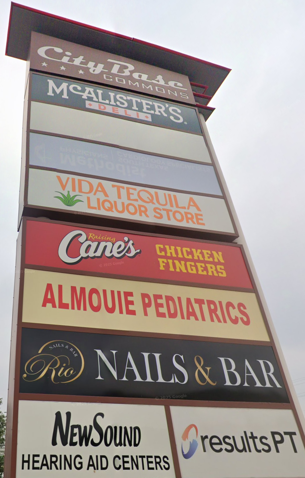 City Base Commons roadside sign displaying restaurant, retail and service tenants
