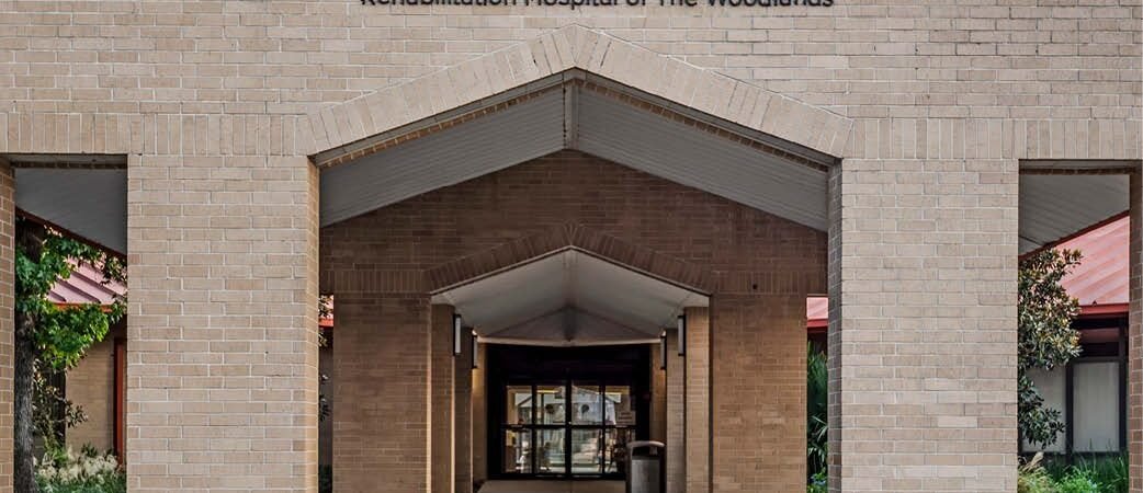 Existing Encompass Health hospital entrance in Conroe with The Woodlands signage