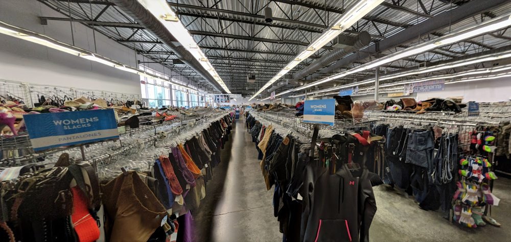 goodwillclothes Clothing racks and shoes inside an existing Goodwill store