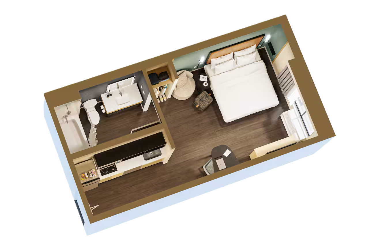 LivSmart Studios king studio layout LivSmart Studios king studio illustration showing a bed, kitchen, bathroom and work table