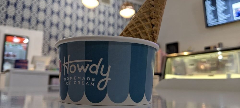Howdy Homemade ice cream cup with a waffle cone at an existing shop