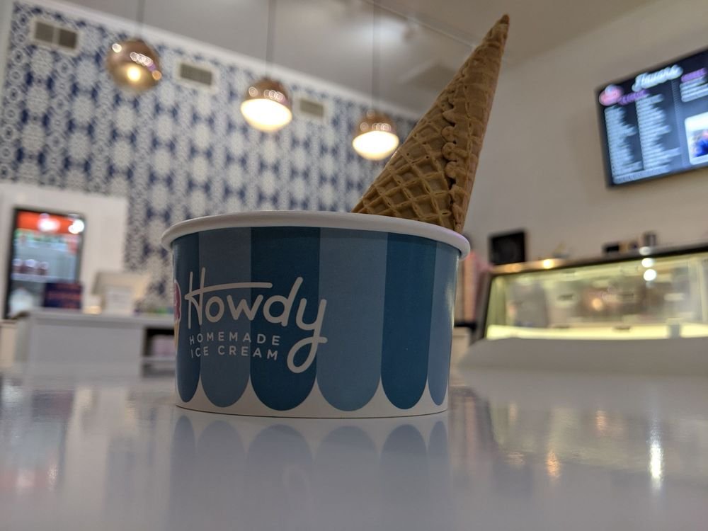Howdy Homemade ice cream cup with a waffle cone at an existing shop