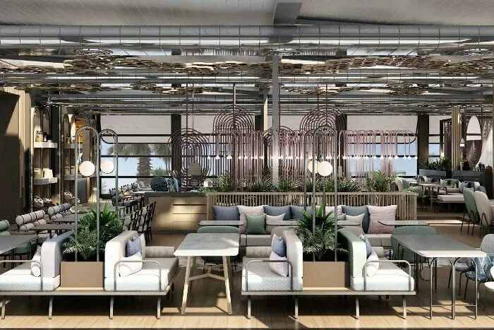 Huqqabaz dining interior with upholstered seating, decorative lights and planters