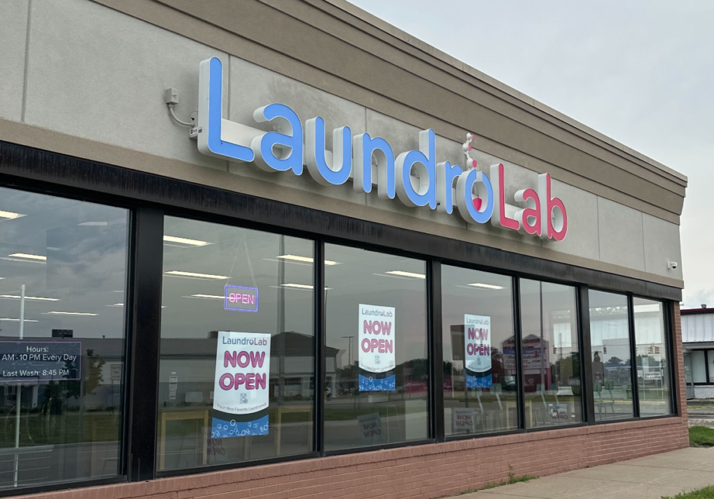 Existing LaundroLab storefront with blue and pink signage, representative image for LaundroLab Round Rock