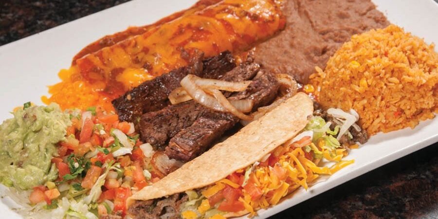 Los Cucos combination plate with grilled beef, enchilada, taco, rice and beans, representative food image for Los Cucos in Fulshear