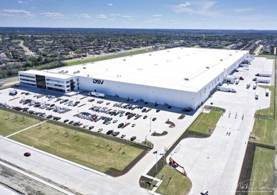 DSV logistics facility aerial — representative Representative DSV logistics facility aerial with a large warehouse, loading areas and parking; not verified as the Denton site