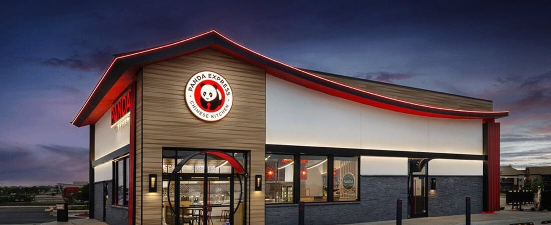 Panda Express Restaurant Exterior Panda Express restaurant exterior with illuminated red trim at dusk.