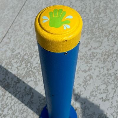 Garland Splash Pad Activation Bollard Handprint activation bollard at an existing Garland splash pad, shown for the Rick Oden splash pad story