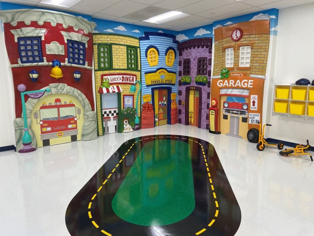 thelearningexperienceinterior The Learning Experience indoor play area with colorful storefront murals