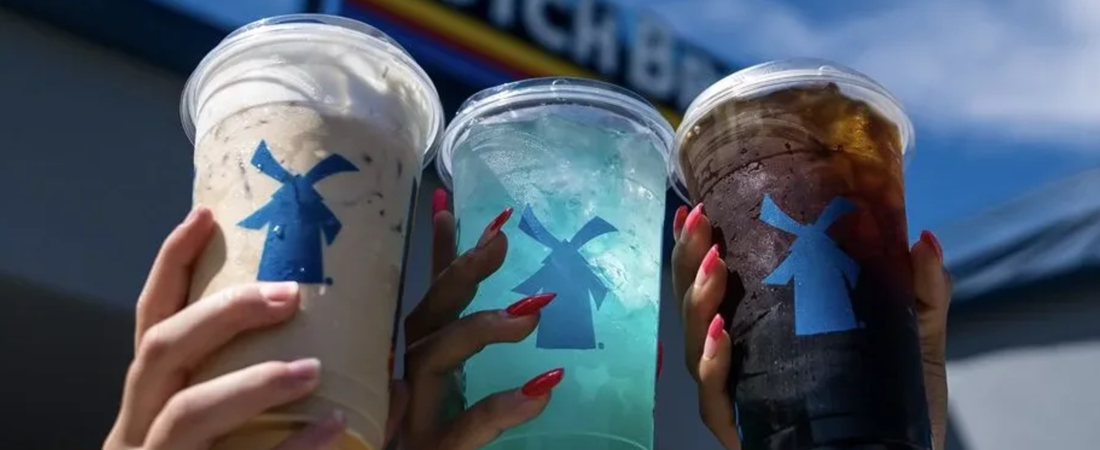 Three colorful Dutch Bros Coffee drinks in branded cups
