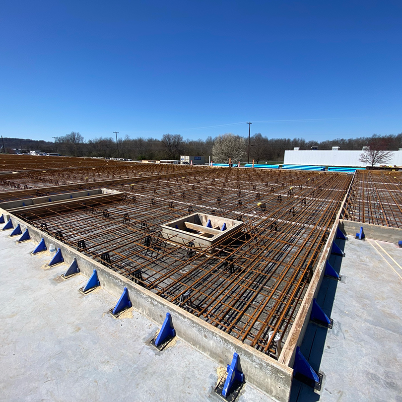 Reinforcing steel arranged within concrete formwork