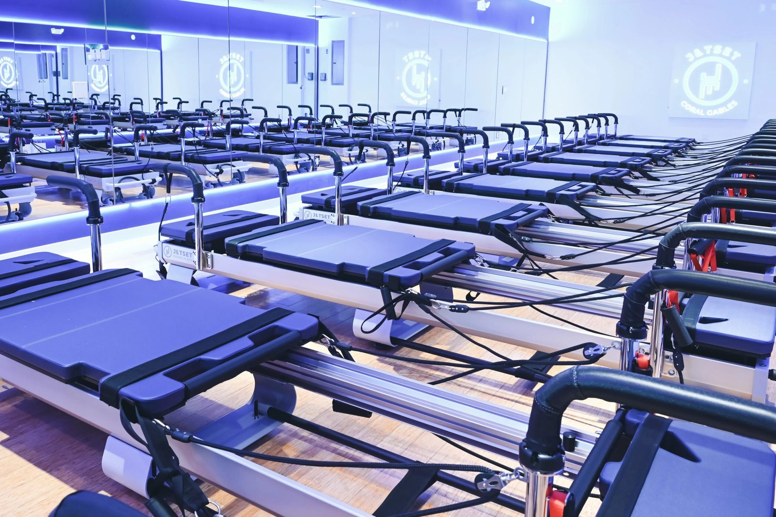 JETSET Pilates Studio JETSET Pilates reformer machines inside a studio