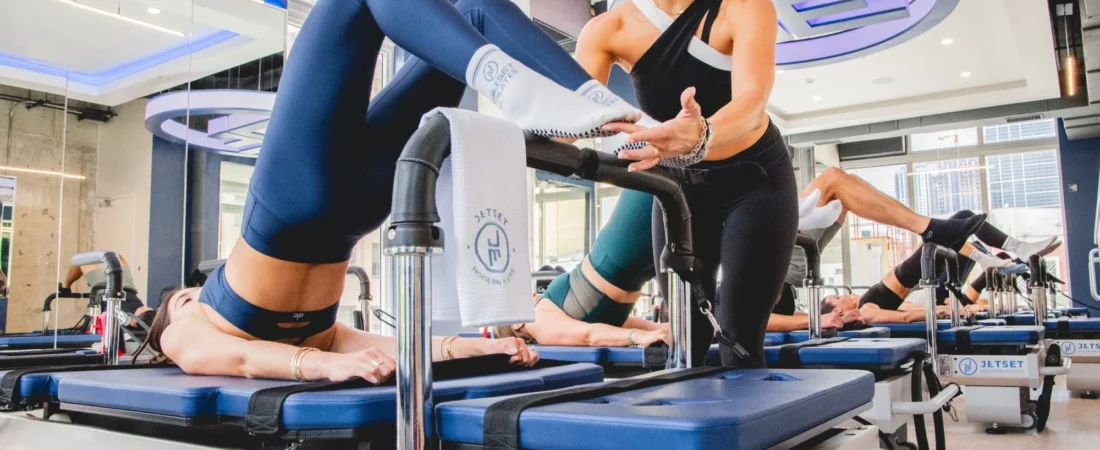 JETSET Pilates Reformer Class Instructor leading a JETSET Pilates reformer class
