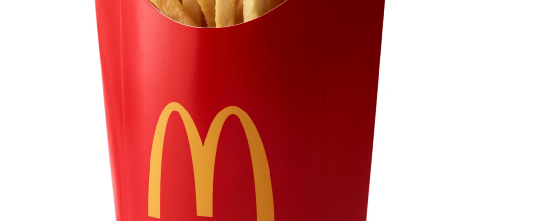 McDonald's Fries — Representative Food Image McDonald's fries in a red carton with golden arches