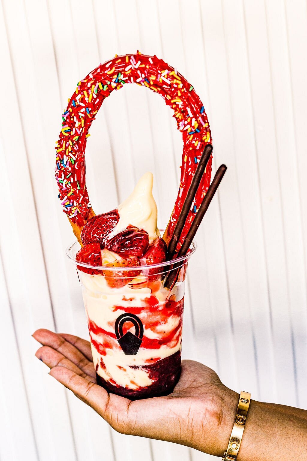 Twist & Buckle Strawberry Churro Sundae Strawberry sundae topped with a red glazed Twist & Buckle churro